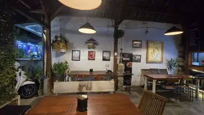 Cozy Balinese Restaurant Interior at Night with Warm Lighting - stock photo