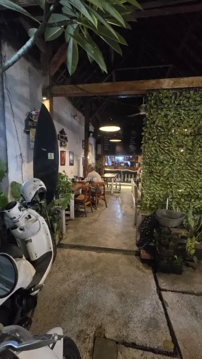 Bali Cafe Evening Scene with Scooter and Tropical Vibe - stock photo