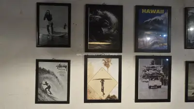 Vintage Surfing Art Prints on Rustic Wall Decor - stock photo