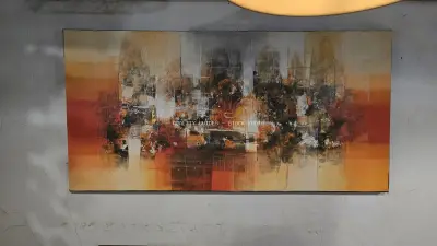 Abstract Painting with Warm Earthy Tones on Modern Wall - stock photo