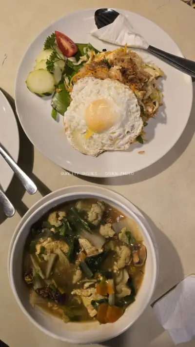 Delicious Indonesian Noodle Dish and Vegetable Soup for Lunch - stock photo