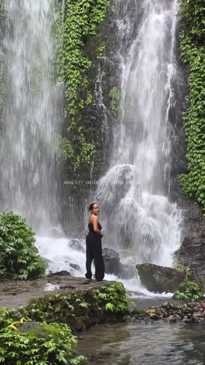 Woman at Banyu Wana Amertha Waterfall Bali Indonesia - stock photo