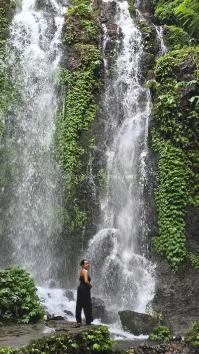 Woman at Banyu Wana Amertha Waterfall Bali Indonesia - stock photo