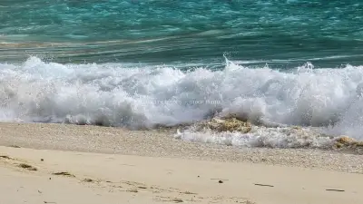 Turquoise Waves Crashing on Kelingking Beach Bali - stock photo