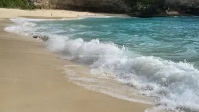 Kelingking Beach Bali Turquoise Waves Sandy Shore - stock photo