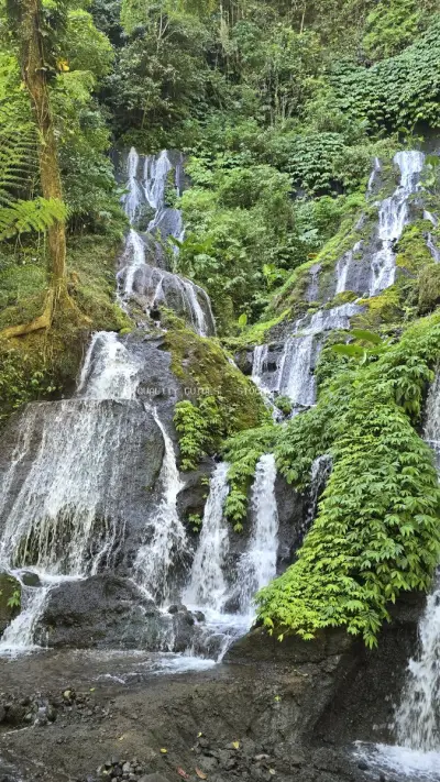 Pucak Manik Waterfall Cascades Bali Tropical Forest - stock photo
