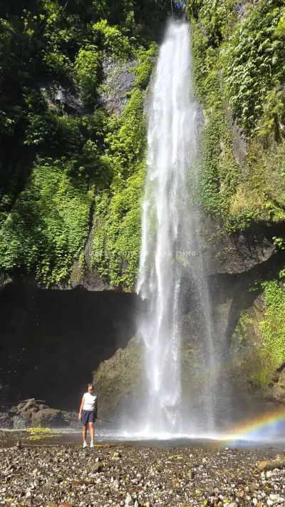 Traveler Standing Before Majestic Waterfall Bali Indonesia - stock photo