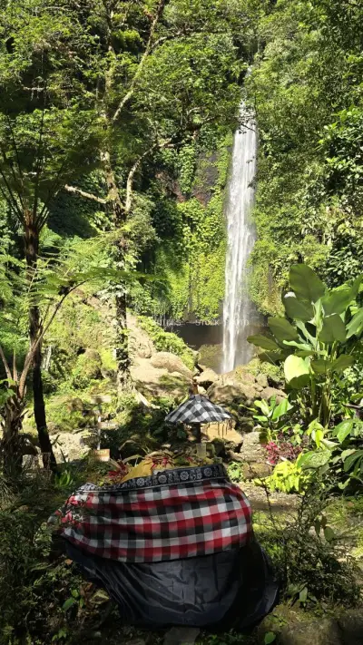 Tropical Waterfall Hike Bali Jungle Adventure Travel - stock photo