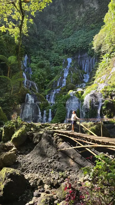 Tropical Waterfall Hike Bali Jungle Adventure Travel - stock photo