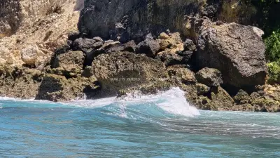 Turquoise Waves Crashing Rocky Cliffs Diamond Beach Bali - stock photo