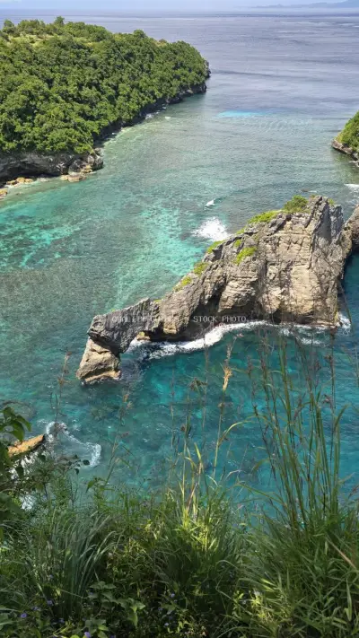 Aerial Diamond Beach Bali Turquoise Waters Coastal Cliffs - stock photo