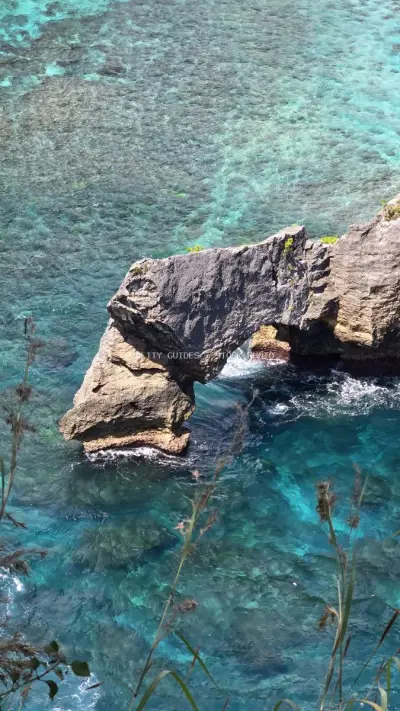 Diamond Beach Bali Aerial Coastal Rock Formation - stock photo