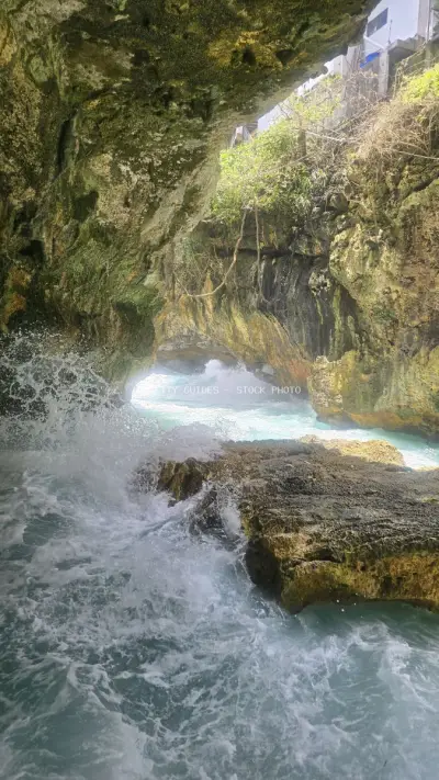 Dramatic Coastal Cave Waves Suluban Beach Bali - stock photo
