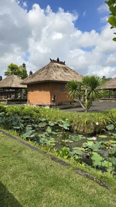 Traditional Balinese Temple Architecture with Thatched Roof - stock photo