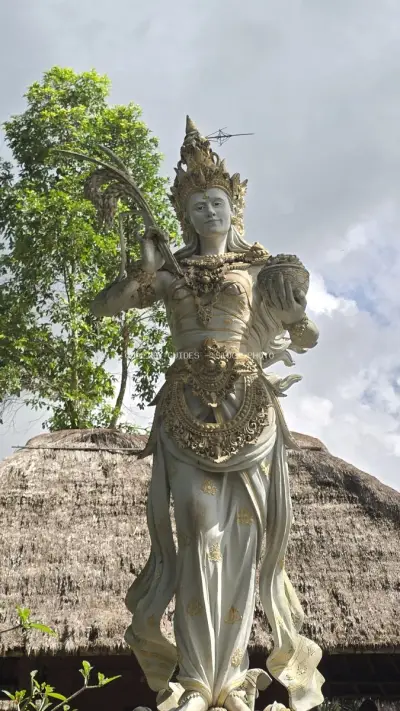 Ornate Balinese Goddess Statue at Taman Ayun Temple - stock photo