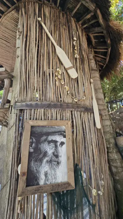 Rustic Wooden Door with Portrait Art Bali - stock photo