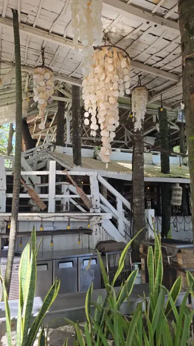 Tropical Beach Club Interior with Shell Chandeliers Bali - stock photo