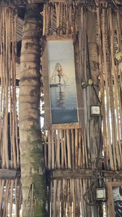 Rustic Wooden Bali Beach Club Decor with Fishing Boat Art - stock photo