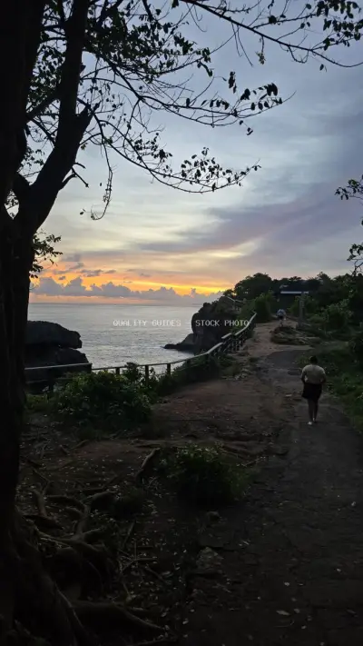 Sunset at Broken Beach Bali with Tropical Tree - stock photo