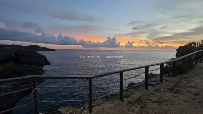Broken Beach Bali Sunset Ocean Viewpoint Railing - stock photo