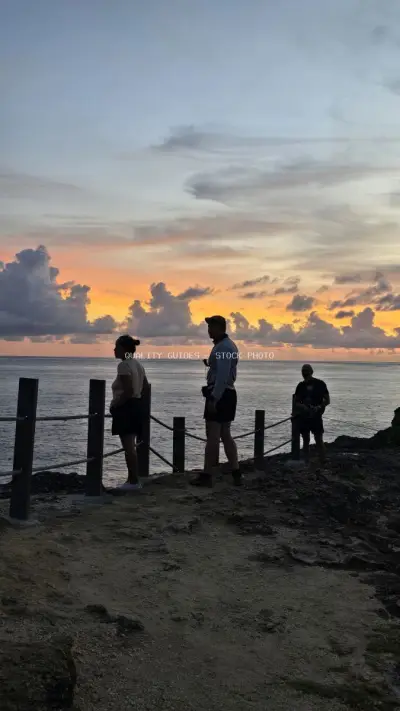 Tourists watching sunset at Broken Beach Bali - stock photo
