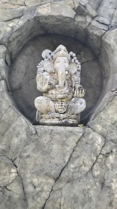 Ancient Stone Ganesha Statue in Bali Temple Niche - stock photo