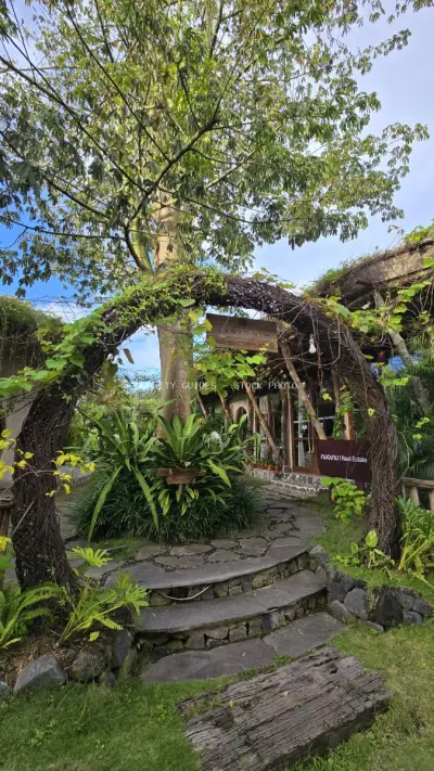Rustic Balinese Garden Entrance with Lush Tropical Vines - stock photo