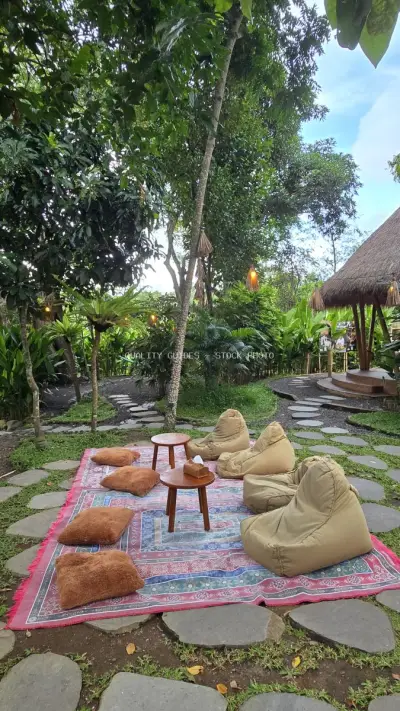 Tropical Garden Lounge Area with Bean Bag Seating Bali - stock photo