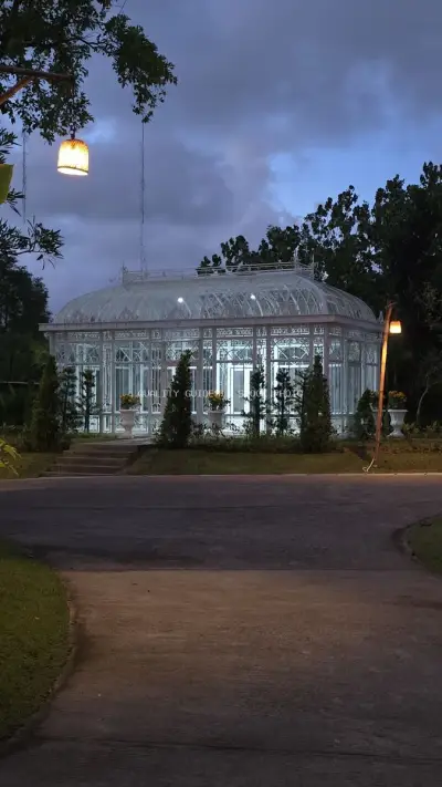 Illuminated Glass Greenhouse at Twilight in Bali - stock photo