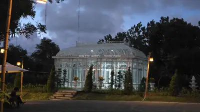 Elegant Glass Greenhouse at Nuanu Creative City Bali Evening - stock photo