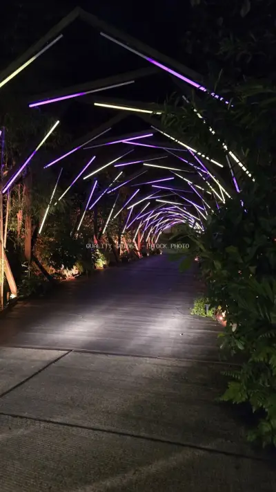 Neon-Lit Tunnel Walkway at Nuanu Creative City Bali - stock photo
