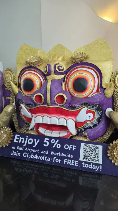 Colorful Balinese Demon Mask Promotional Display Bali Airport - stock photo