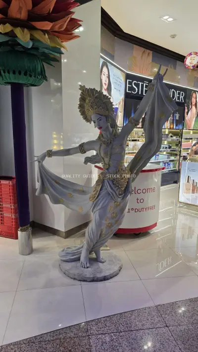 Balinese Dancer Statue Duty Free Shop Bali Airport - stock photo