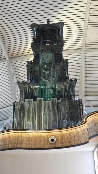 Balinese Clock Tower Sculpture Airport Terminal Interior - stock photo