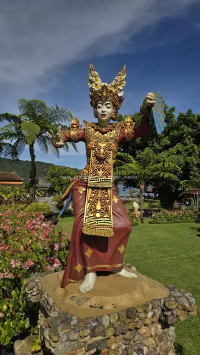 Golden Balinese Statue at Ulun Danu Beratan Temple Bali - stock photo