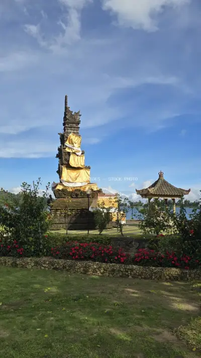 Golden Buddha Statue Ulun Danu Beratan Temple Bali - stock photo