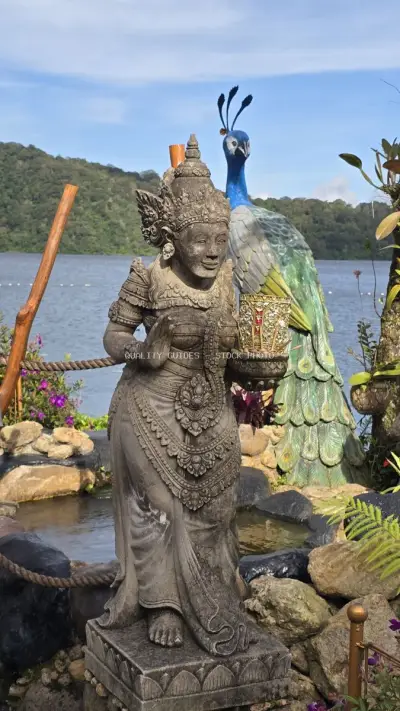 Balinese Statue with Peacock at Ulun Danu Beratan Temple - stock photo