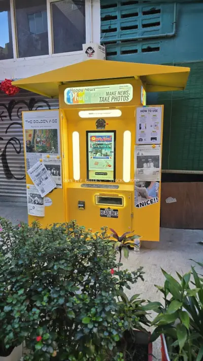 Bright Yellow Photo Booth Kiosk Kwai Chai Hong Kuala Lumpur - stock photo