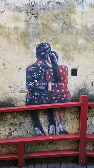 Street Art Mural Girl on Red Bench Kuala Lumpur - stock photo