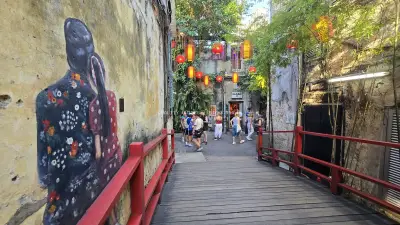 Kwai Chai Hong Kuala Lumpur Street Art Alley with Tourists - stock photo
