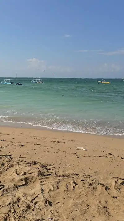Mertasari Beach Bali B-Roll Footage: Sunny Tropical Ocean and Boats - stock photo