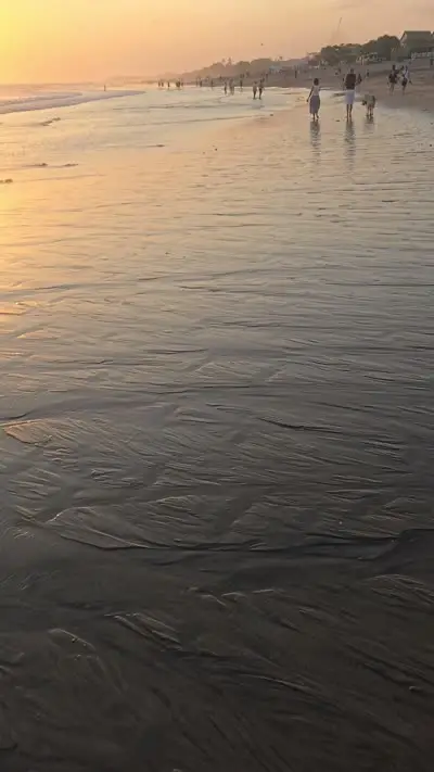 Bali Beach Sunset B-Roll Footage with Golden Hour Ocean Waves and People - stock photo