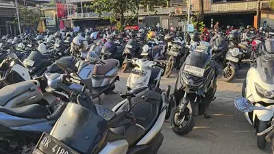 Crowded Bali Scooter Parking Lot B-Roll Footage at Batu Bolong Beach - stock photo