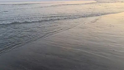 Bali Echo Beach Sunset B-roll Footage with Ocean Waves and Golden Hour - stock photo