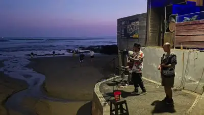 Bali Beach Live Music B-Roll Footage at Sunset - stock photo