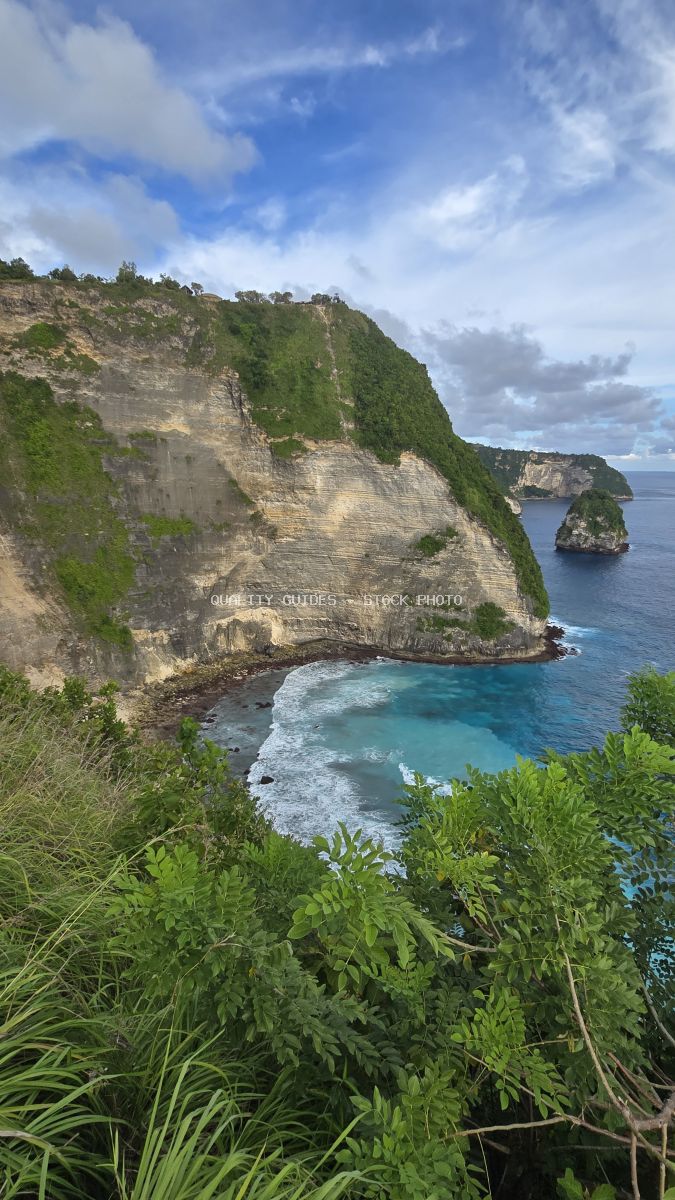 Dramatic limestone cliffs with turquoise ocean at Kelingking Beach, Bali, Indonesia - stock photo