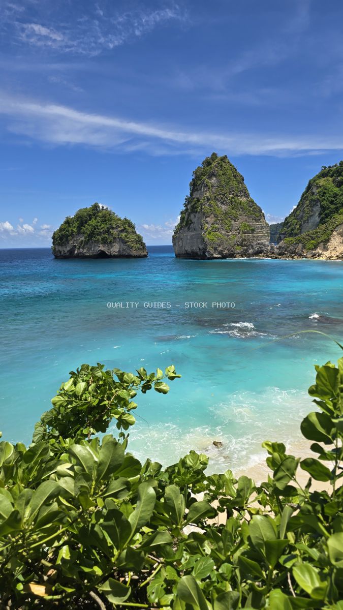 Turquoise tropical beach with dramatic limestone cliffs and white sand at Diamond Beach, Bali - stock photo