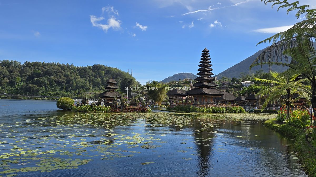 Ulun Danu Beratan Temple reflected in lake with water lilies, Bali Indonesia - stock photo